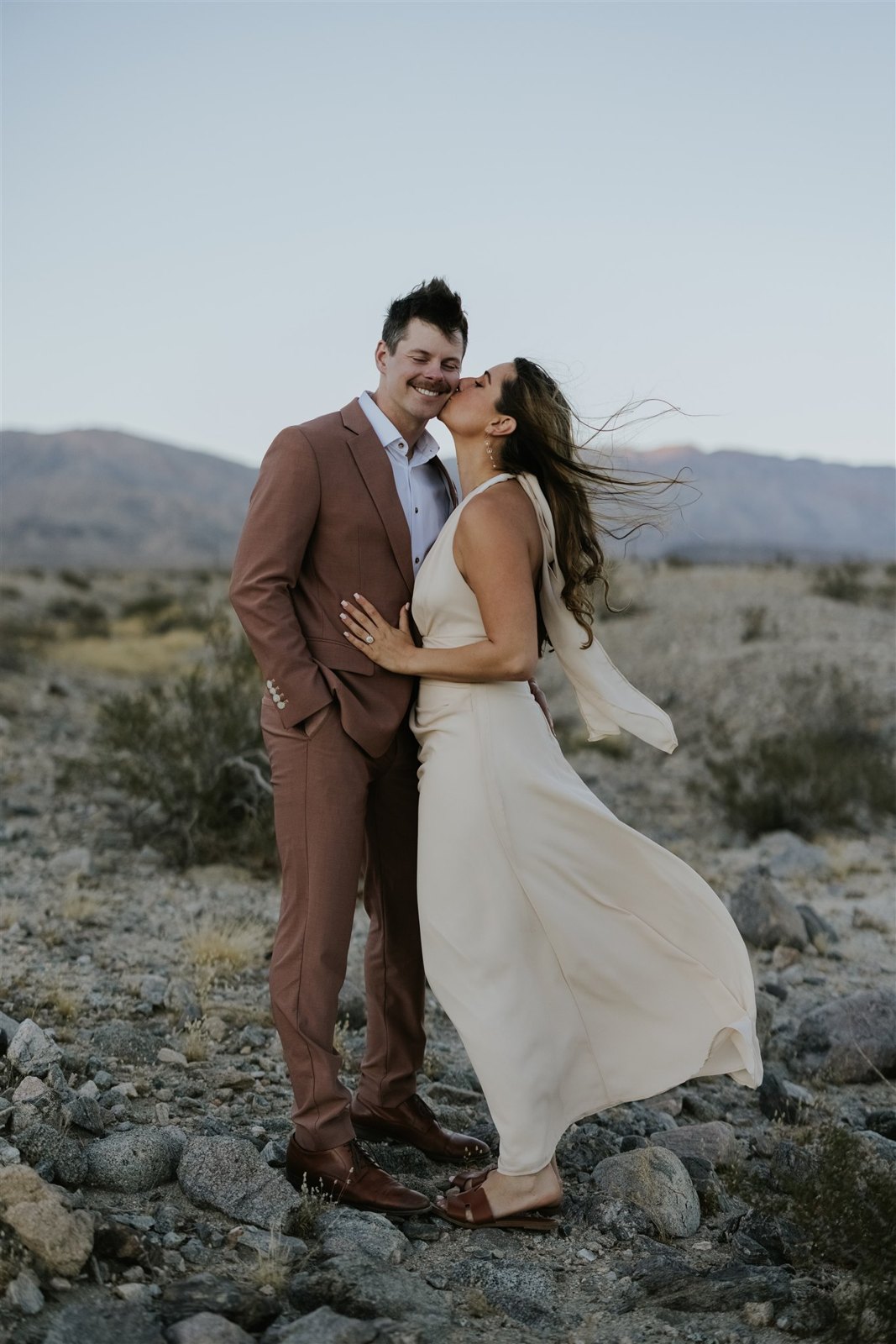 A kiss on the cheek in the desert wind