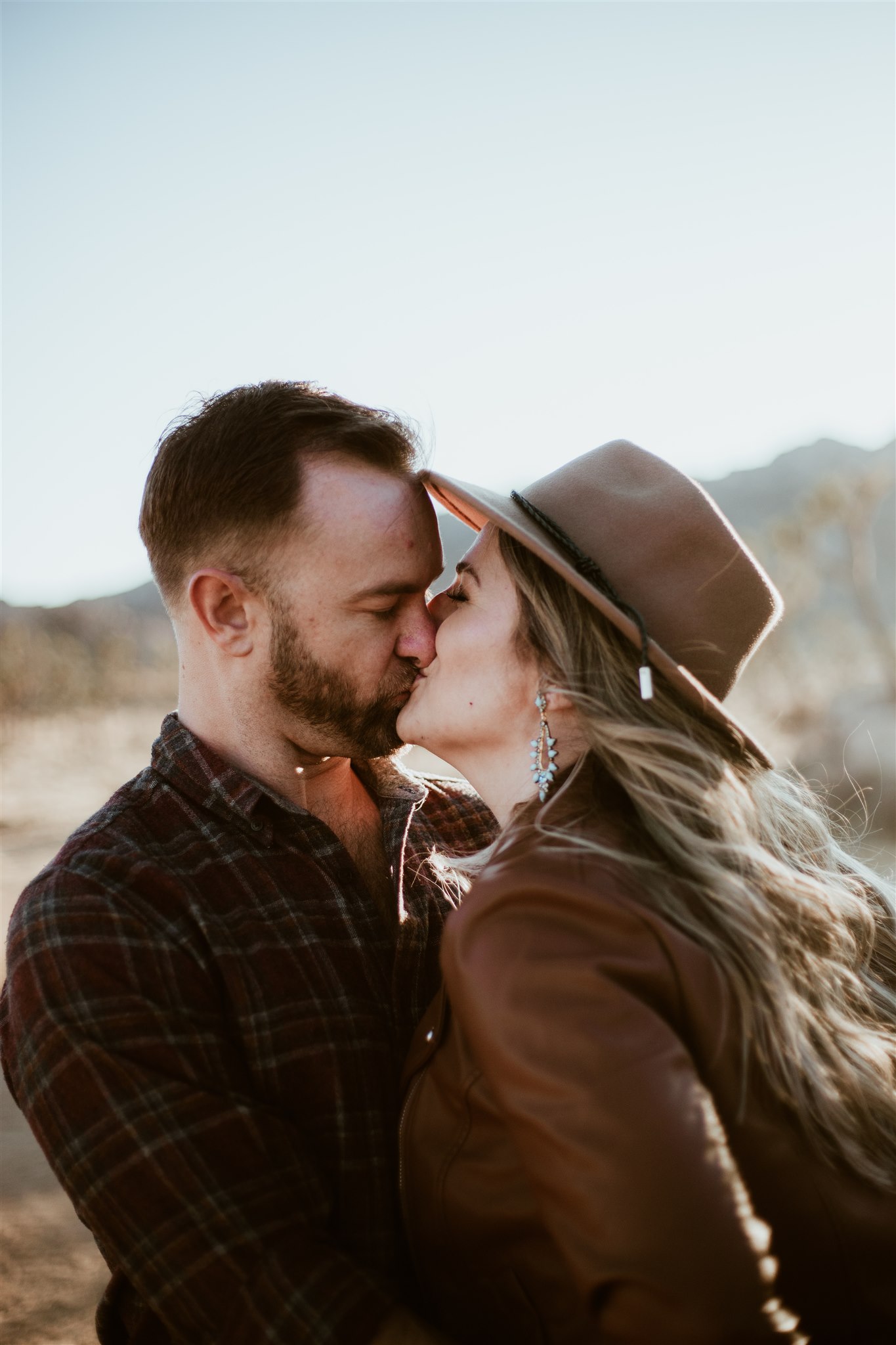 A couple kissing at golden hour in Joshua Tree