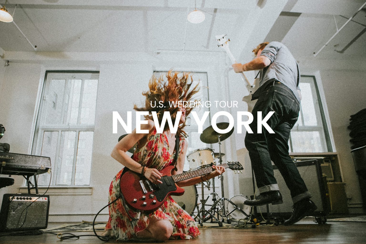 Wedding couple playing guitar together in a music studio